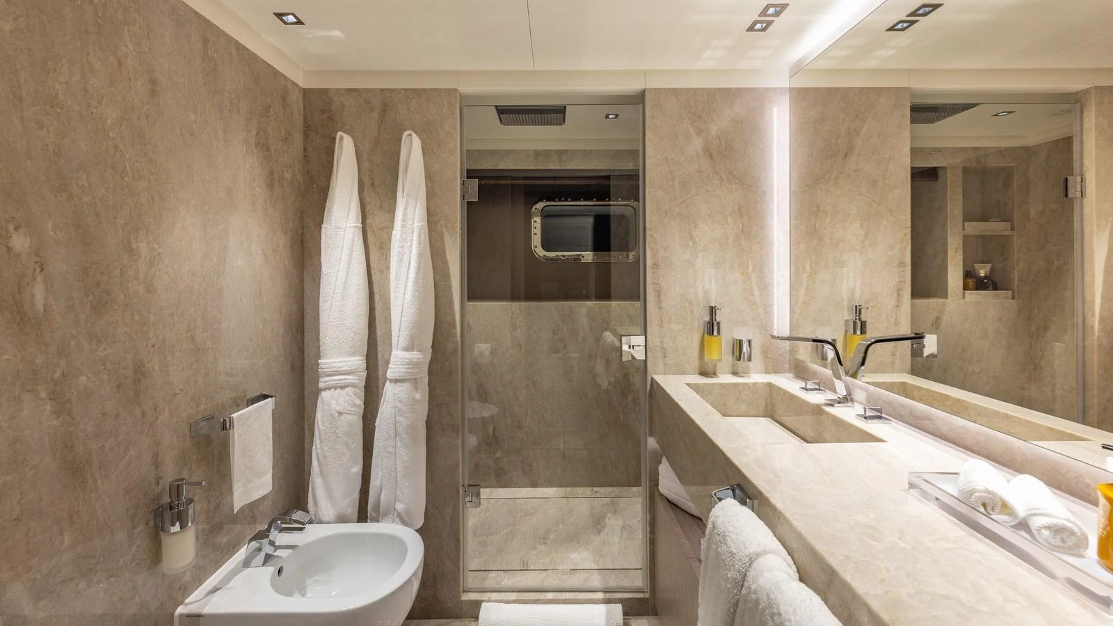 The yacht's bathroom features a luxurious design with elegant fixtures and a spacious shower area. aboard GIOIA Yacht for Sale