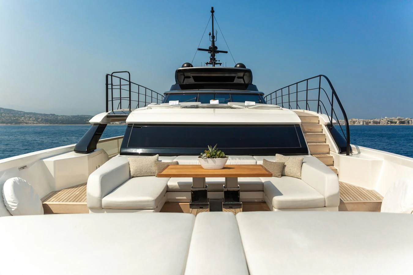 The yacht's foredeck features a spacious seating area with plush cushions and a central table, perfect for relaxation and socializing. aboard NANGARA Yacht for Sale