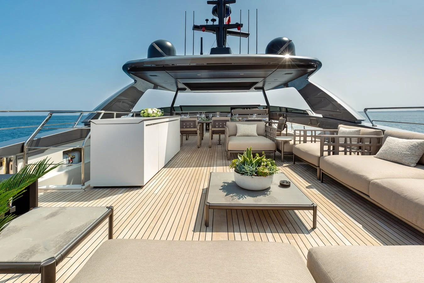 The sundeck offers a luxurious outdoor space with ample seating and a bar area, perfect for relaxation and entertainment. aboard NANGARA Yacht for Sale
