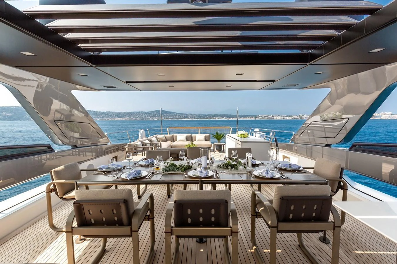 The aft deck features an elegant dining area with panoramic ocean views. aboard NANGARA Yacht for Sale