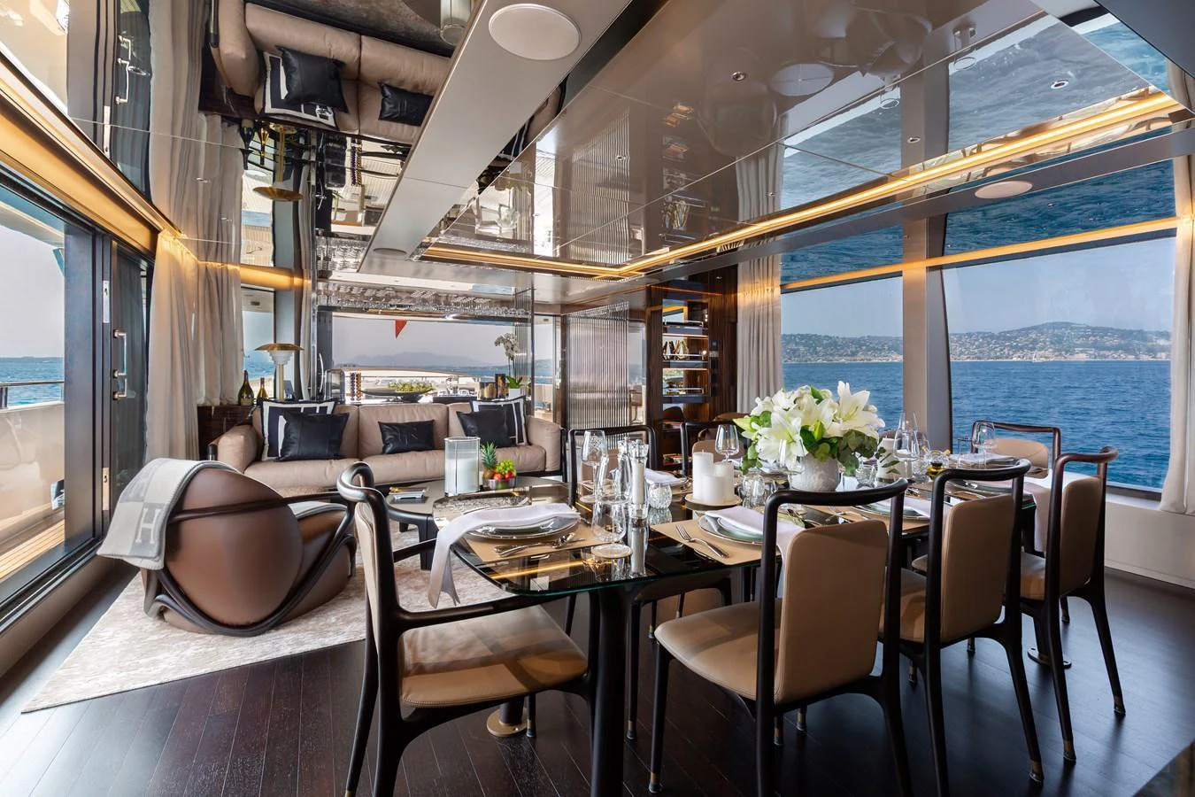 The yacht's dining area offers an elegant setting with panoramic ocean views and luxurious furnishings. aboard NANGARA Yacht for Sale