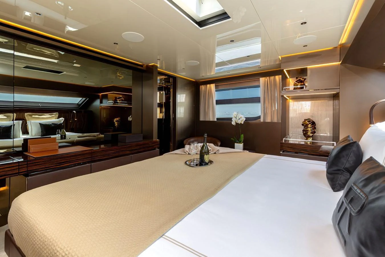 The master stateroom features a luxurious bed with elegant decor and ample natural light. aboard NANGARA Yacht for Sale