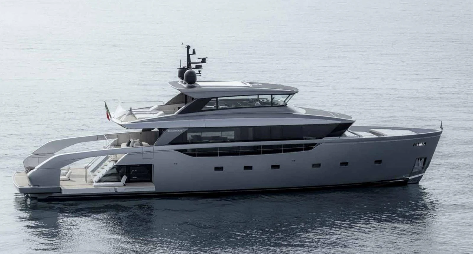 A sleek and modern yacht is gracefully cruising on calm waters. aboard SANLORENZO SX100/159 Yacht for Sale