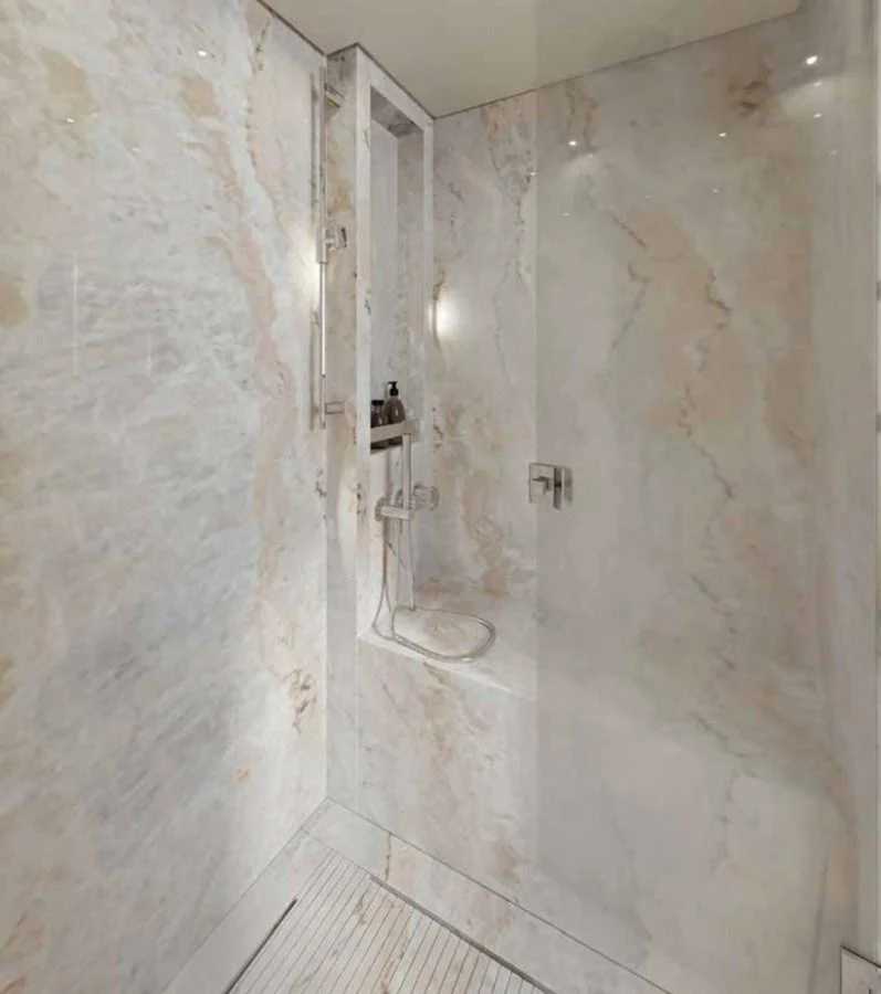 The yacht features a luxurious marble shower with modern fixtures. aboard SANLORENZO SX100/159 Yacht for Sale