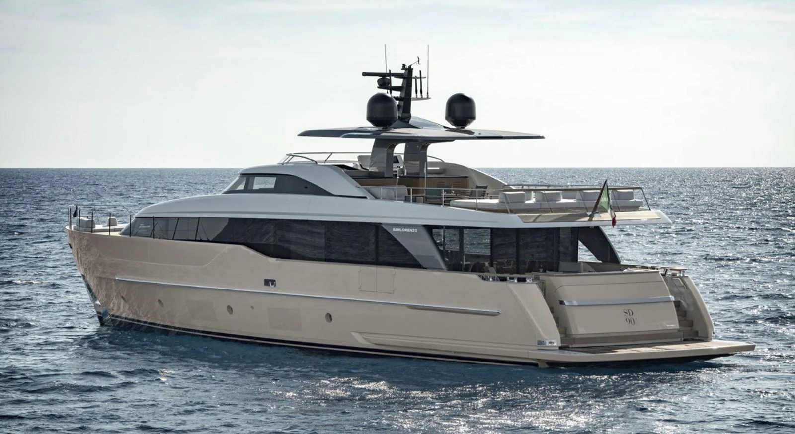 A sleek and modern yacht cruising on calm waters under a clear sky. aboard SD90 Yacht for Sale