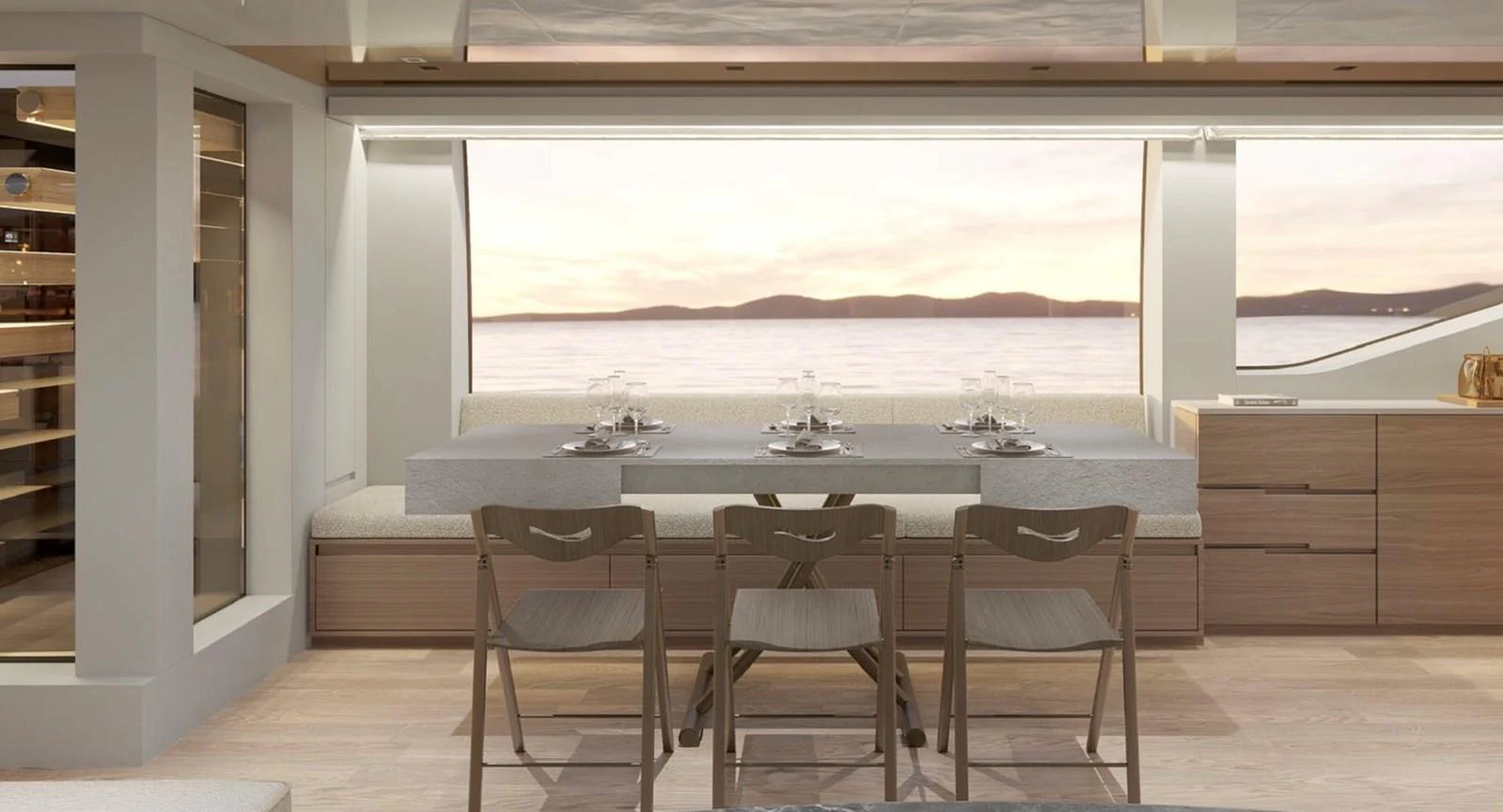 The yacht's dining area offers a serene view of the sea through large windows, complemented by a modern and elegant design. aboard SL90A Yacht for Sale