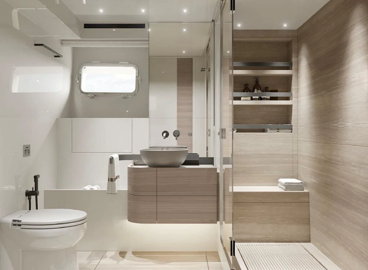 A modern and elegant yacht bathroom with sleek fixtures and a spacious shower. aboard SL90A Yacht for Sale