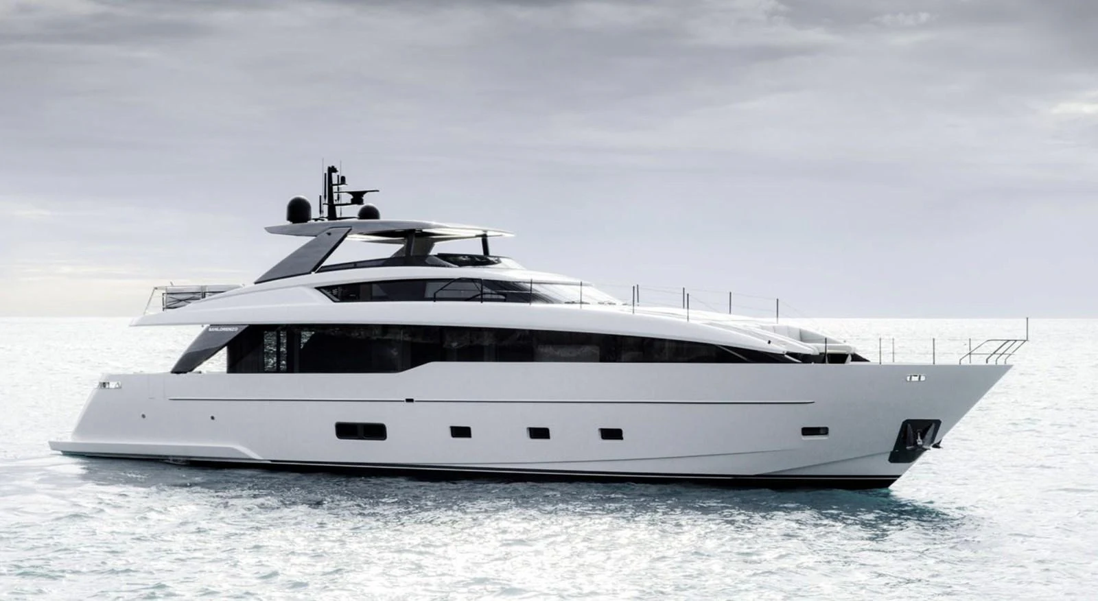 A sleek and modern yacht cruising on calm waters under a cloudy sky. aboard SL86A Yacht for Sale