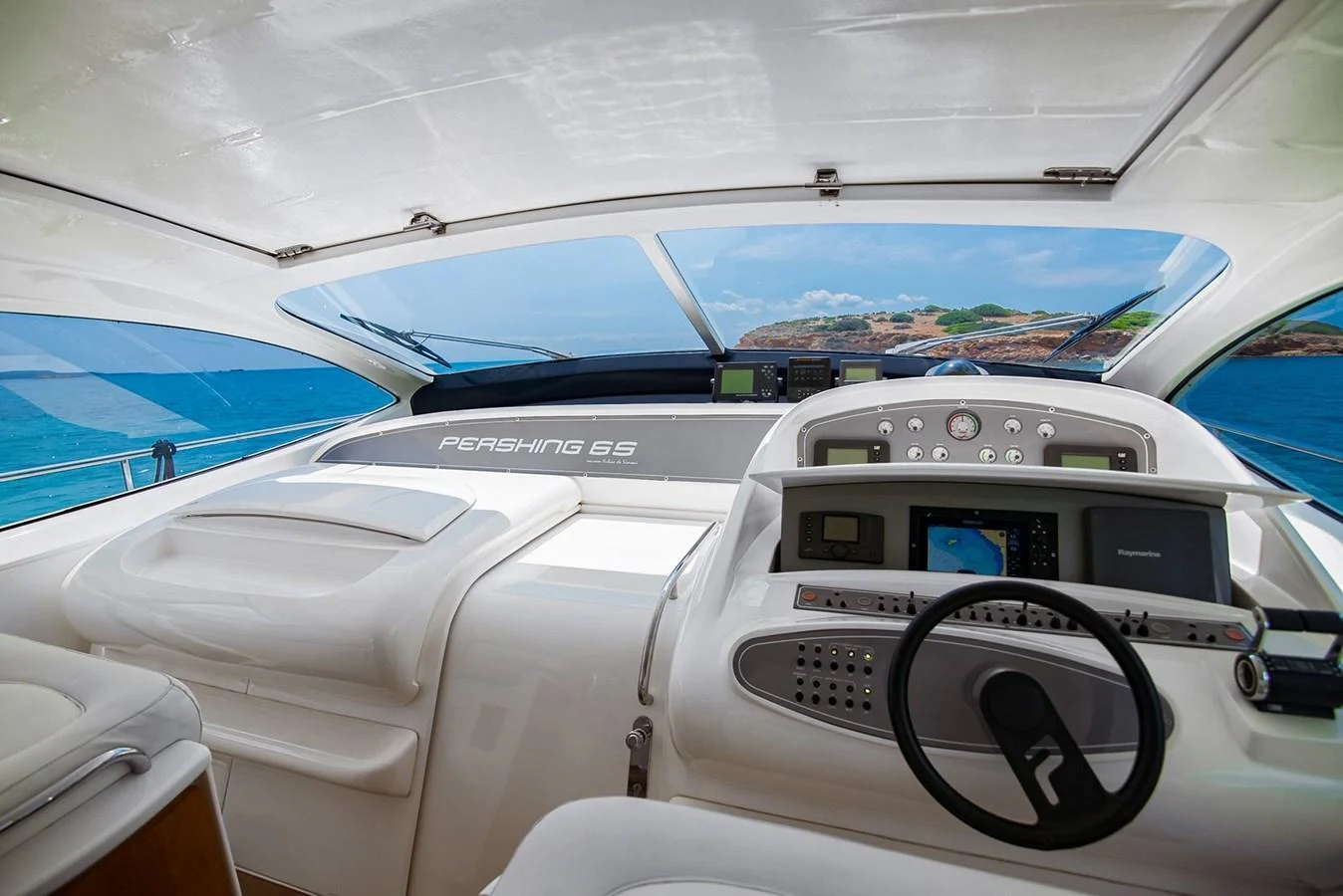 The helm of the yacht offers a sleek and modern control area with expansive views of the sea. aboard AXION Yacht for Sale