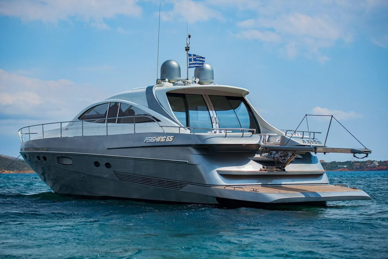 A sleek and modern yacht glides gracefully on the water, showcasing its elegant design and luxurious features. aboard AXION Yacht for Sale