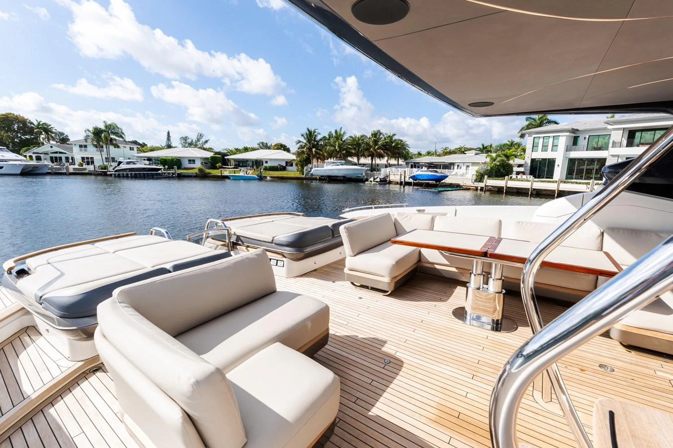The aft deck offers a spacious and inviting area for relaxation and socializing with comfortable seating and a beautiful view of the water. aboard NAUTI NATALIE Yacht for Sale