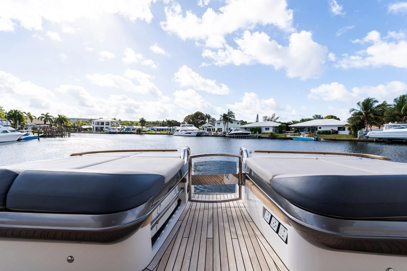 The aft deck offers a serene view of the marina, perfect for relaxation. aboard NAUTI NATALIE Yacht for Sale