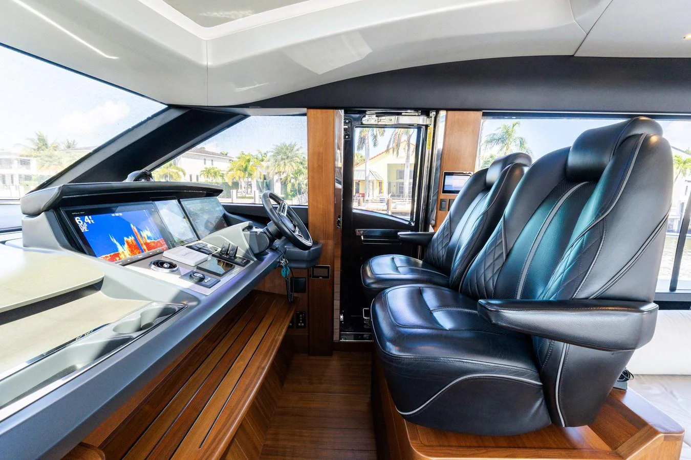 The helm features luxurious leather seating and state-of-the-art navigation equipment. aboard NAUTI NATALIE Yacht for Sale