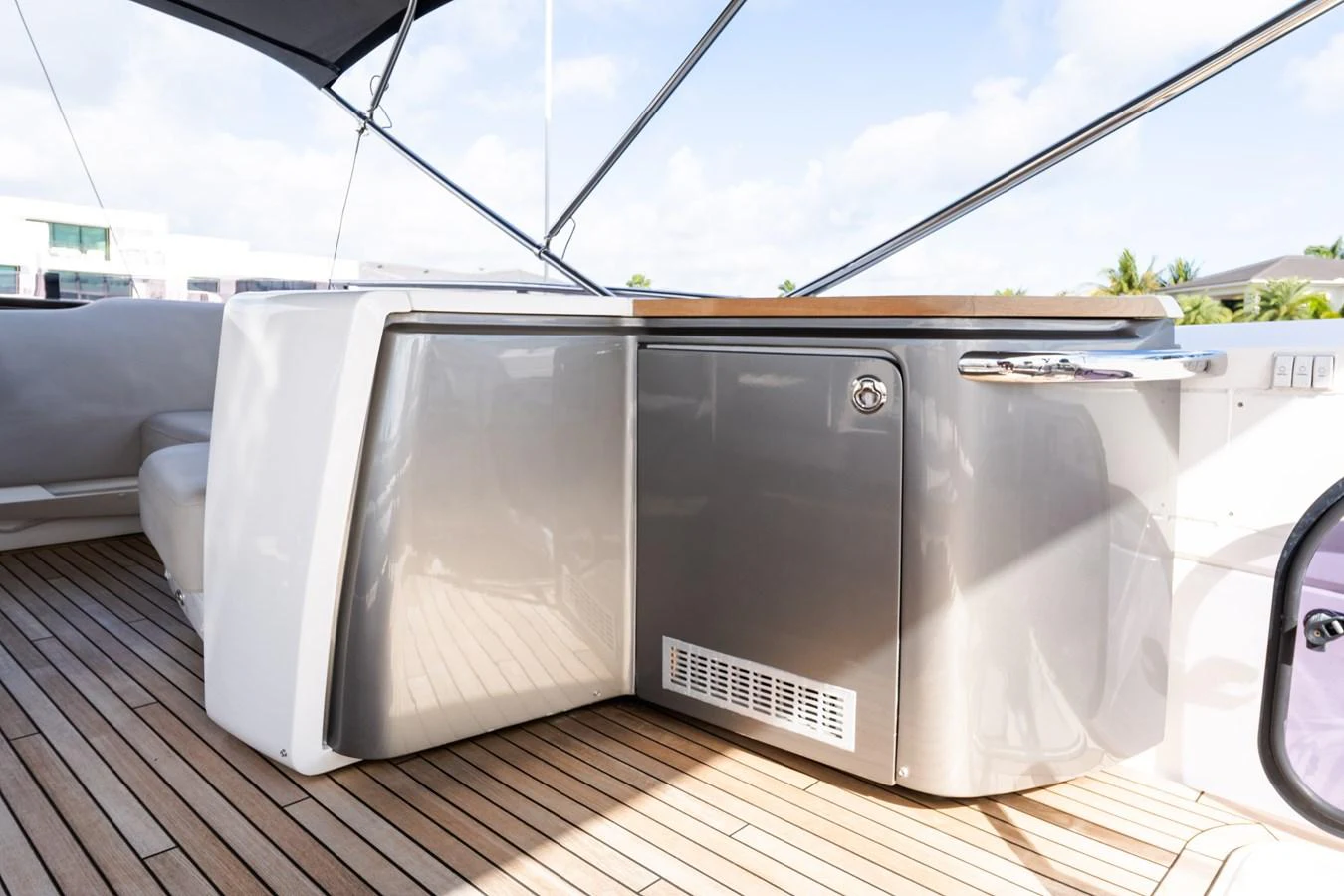 The image showcases a sleek, modern outdoor kitchenette area on the yacht. aboard NAUTI NATALIE Yacht for Sale