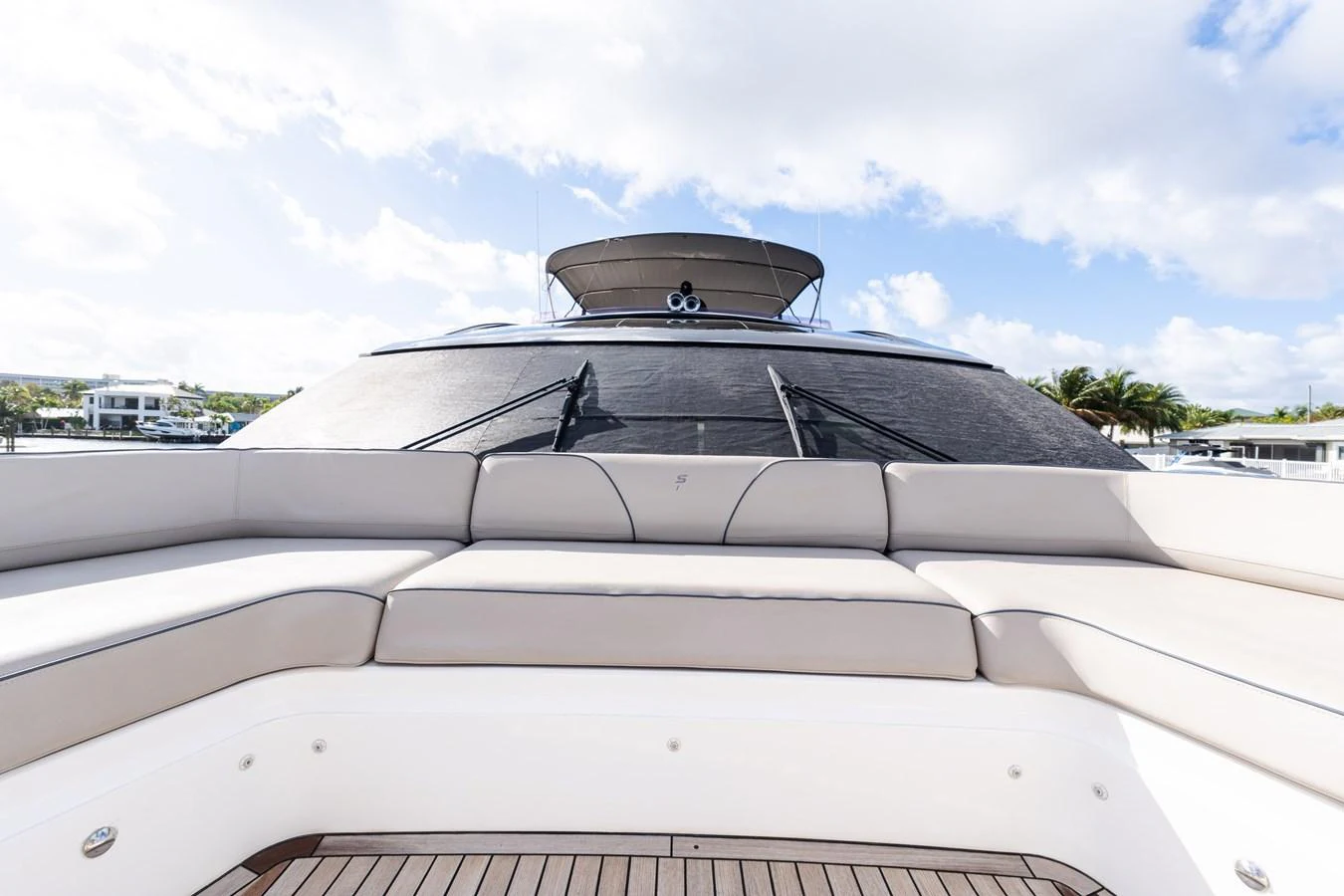The yacht features a spacious and inviting bow seating area with plush cushions and a sleek design. aboard NAUTI NATALIE Yacht for Sale