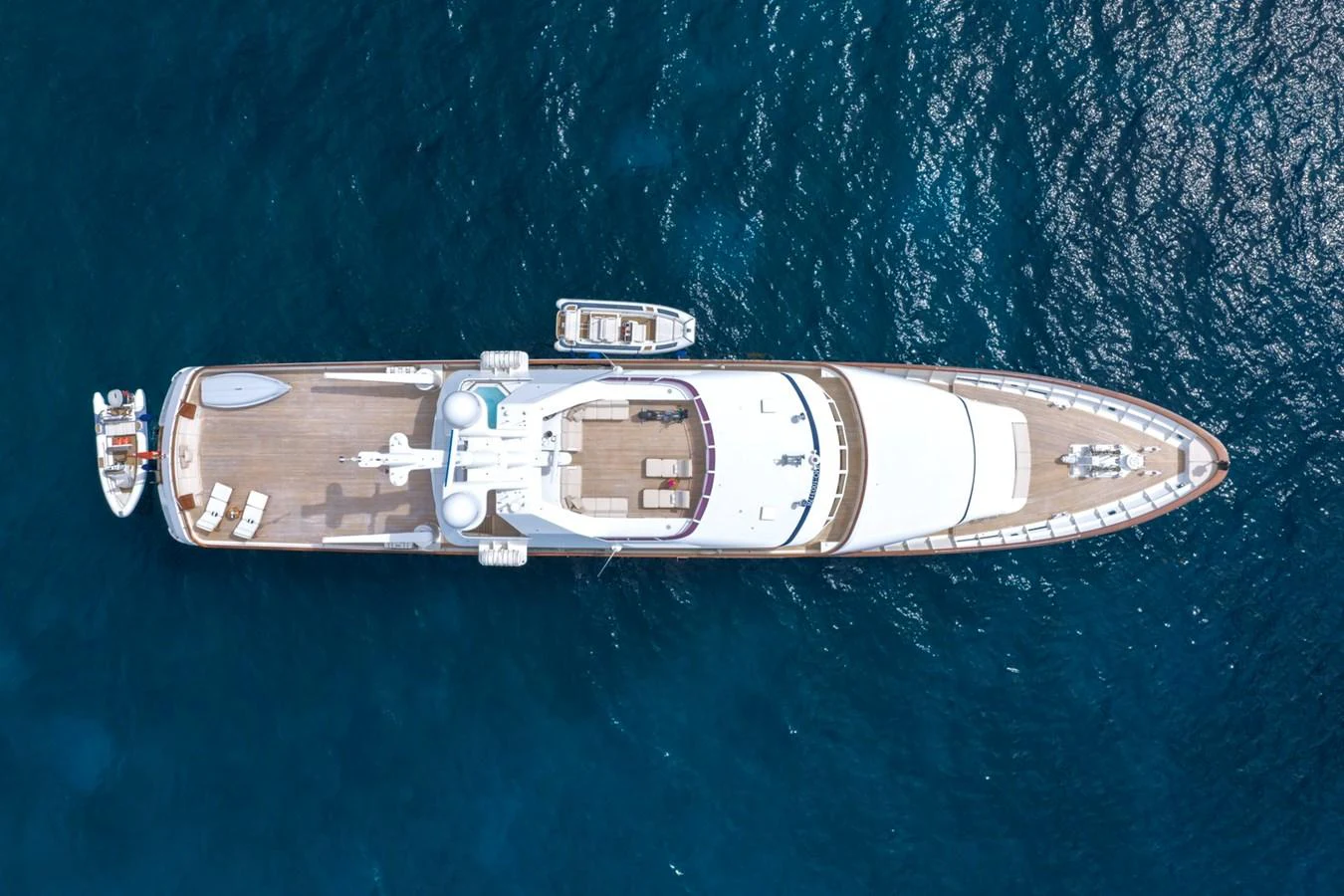 A stunning aerial view of a luxurious yacht cruising on the open sea. aboard CONSTANCE Yacht for Sale