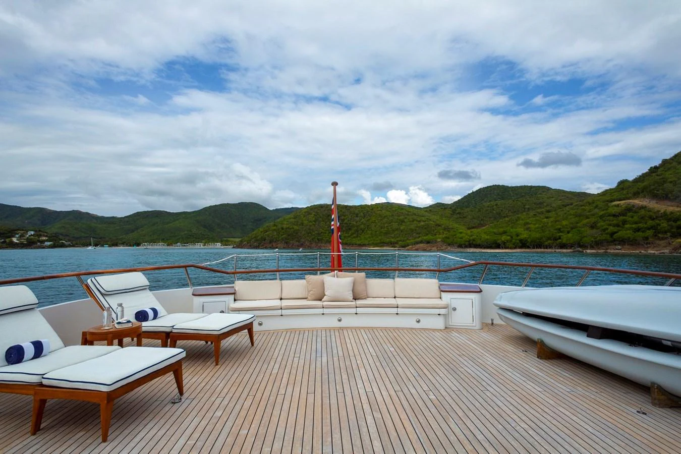 The aft deck offers a spacious lounging area with comfortable seating and scenic views. aboard CONSTANCE Yacht for Sale