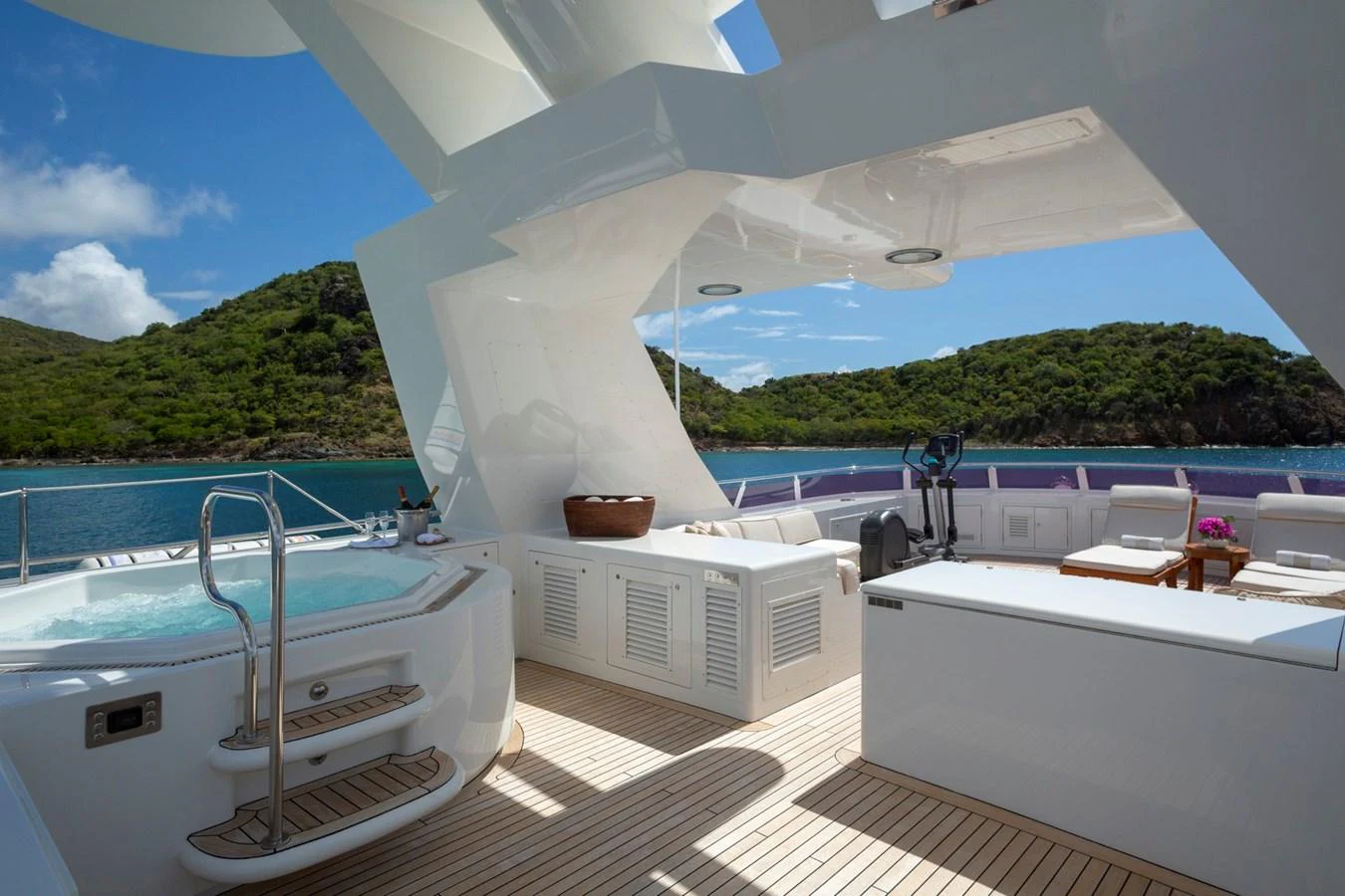 The sundeck features a luxurious hot tub with stunning views of the surrounding landscape. aboard CONSTANCE Yacht for Sale