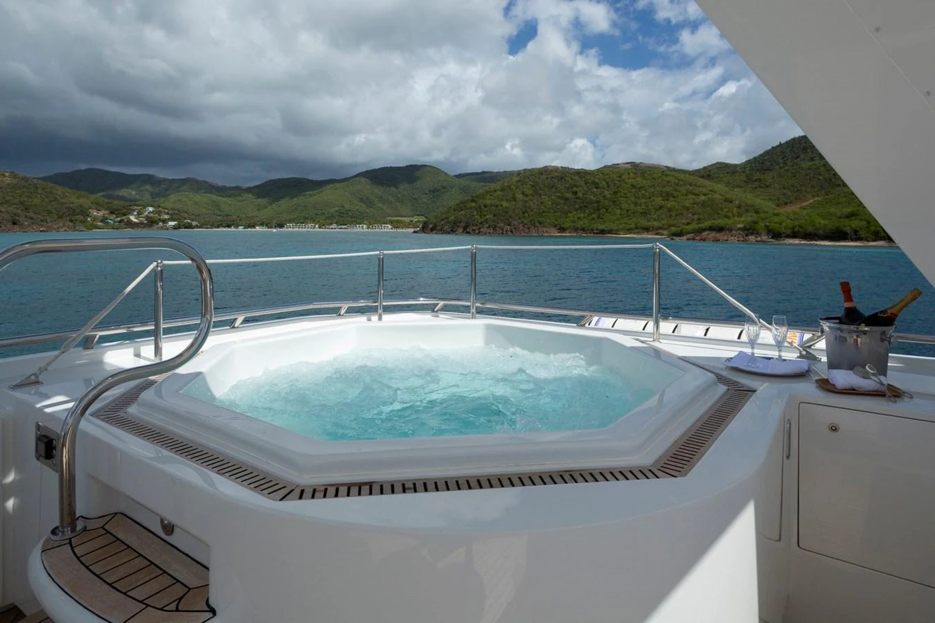 The yacht features a luxurious jacuzzi on the deck with stunning views of the surrounding landscape. aboard CONSTANCE Yacht for Sale