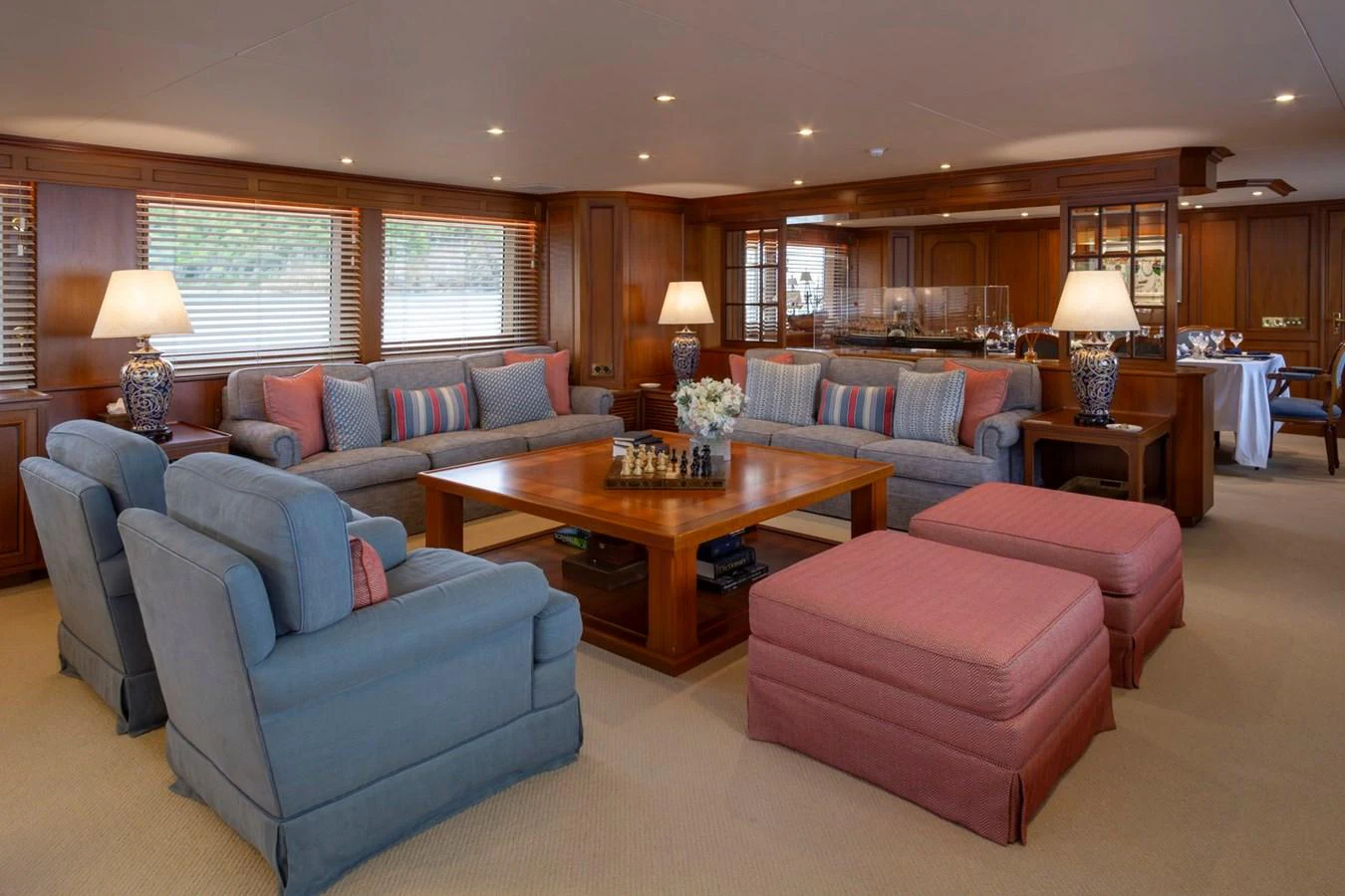 The salon features comfortable seating with elegant decor and ample natural light. aboard CONSTANCE Yacht for Sale