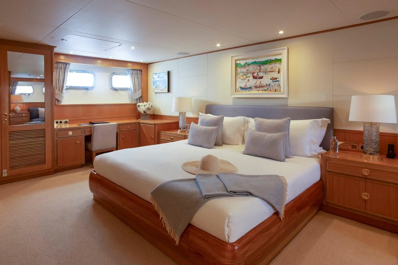 The master stateroom features a spacious bed, elegant decor, and ample natural light. aboard CONSTANCE Yacht for Sale