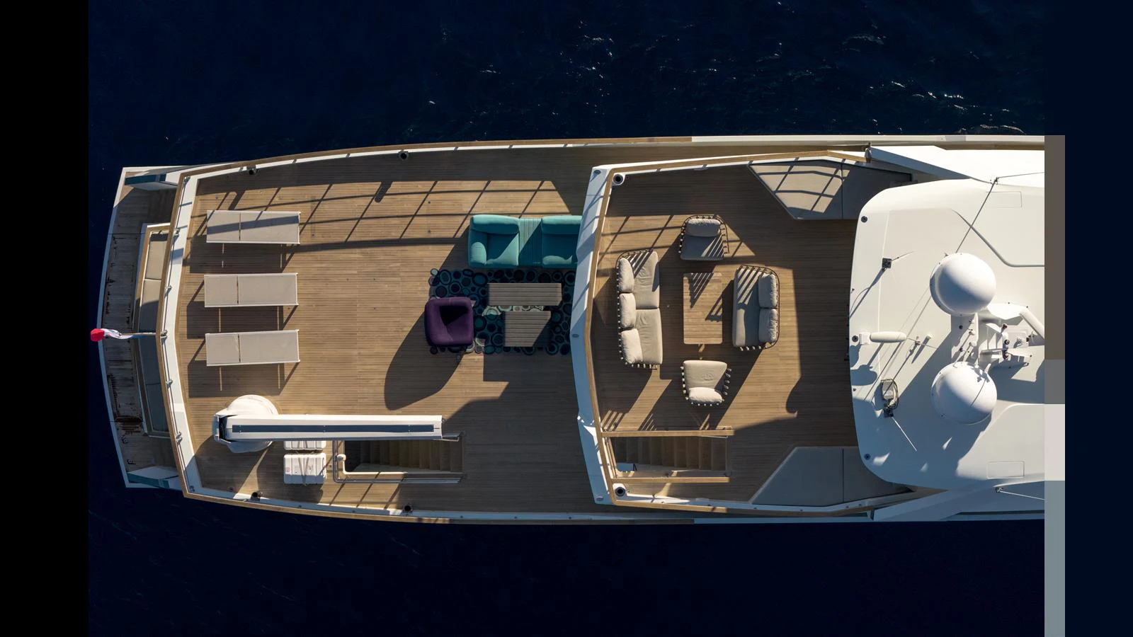 The sundeck offers ample lounging space with modern furniture and a clear view of the surroundings. aboard Q.M Yacht for Sale