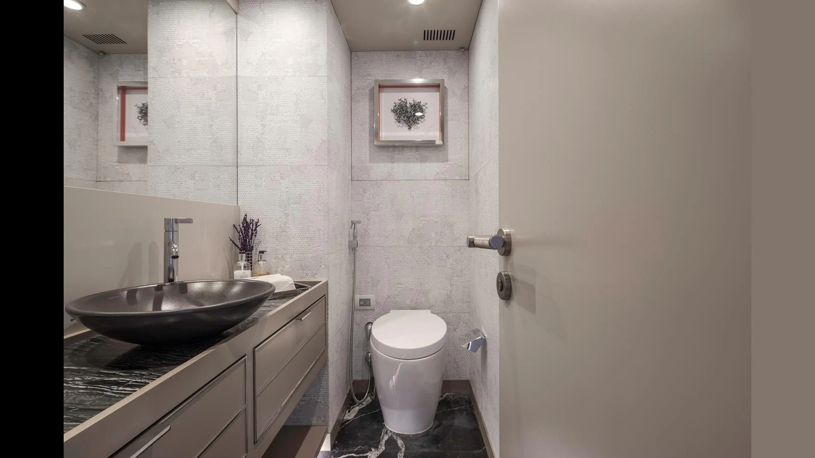 A modern yacht bathroom with sleek fixtures and elegant decor. aboard Q.M Yacht for Sale