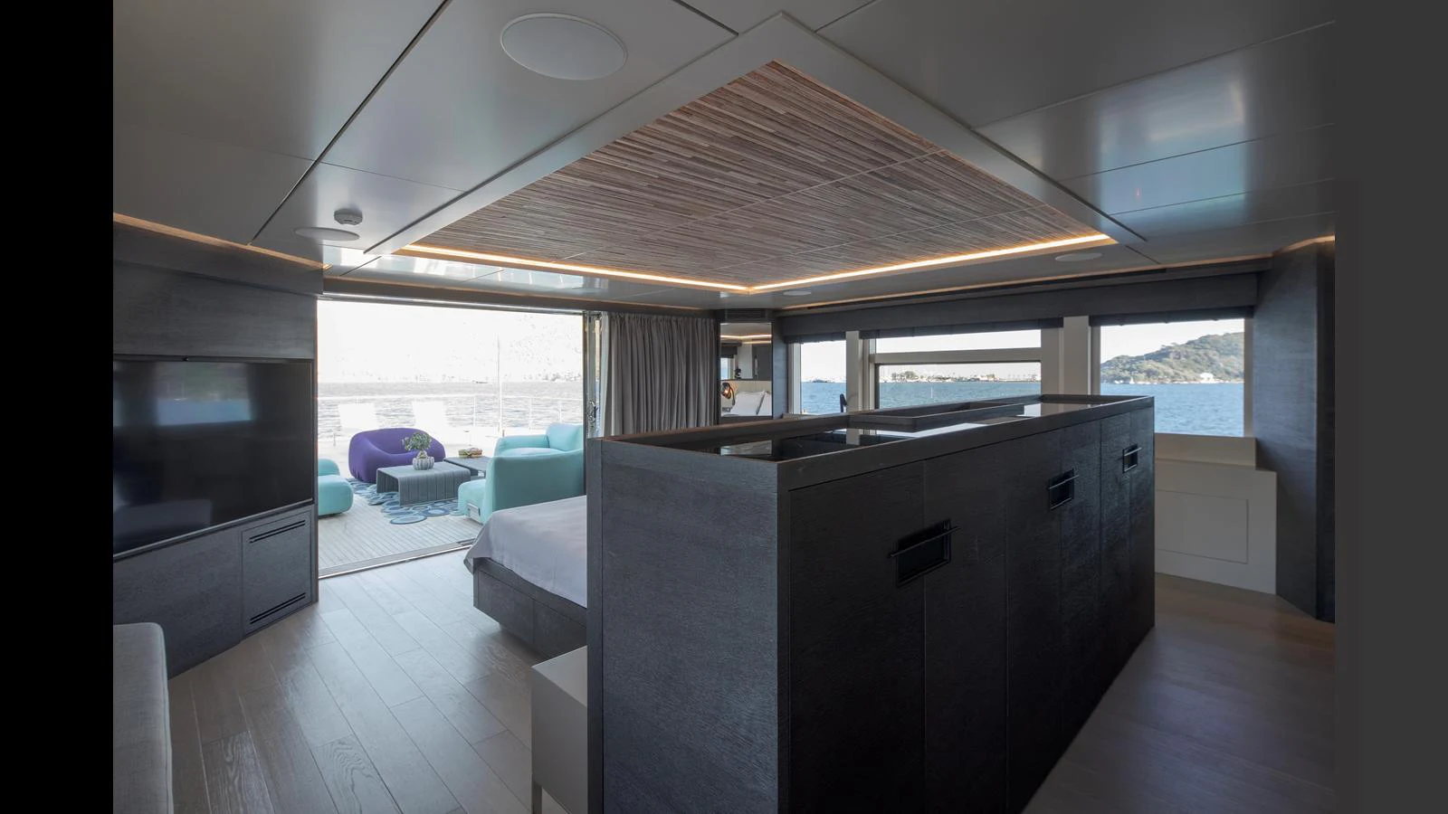 The yacht's interior features a modern, open-plan living area with large windows offering stunning sea views. aboard Q.M Yacht for Sale