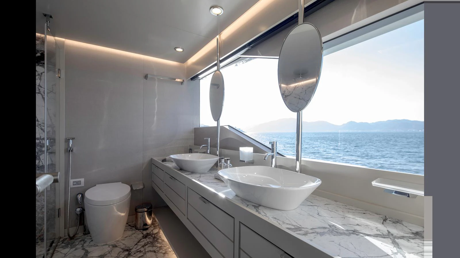 The yacht's bathroom features modern fixtures and a stunning ocean view. aboard Q.M Yacht for Sale