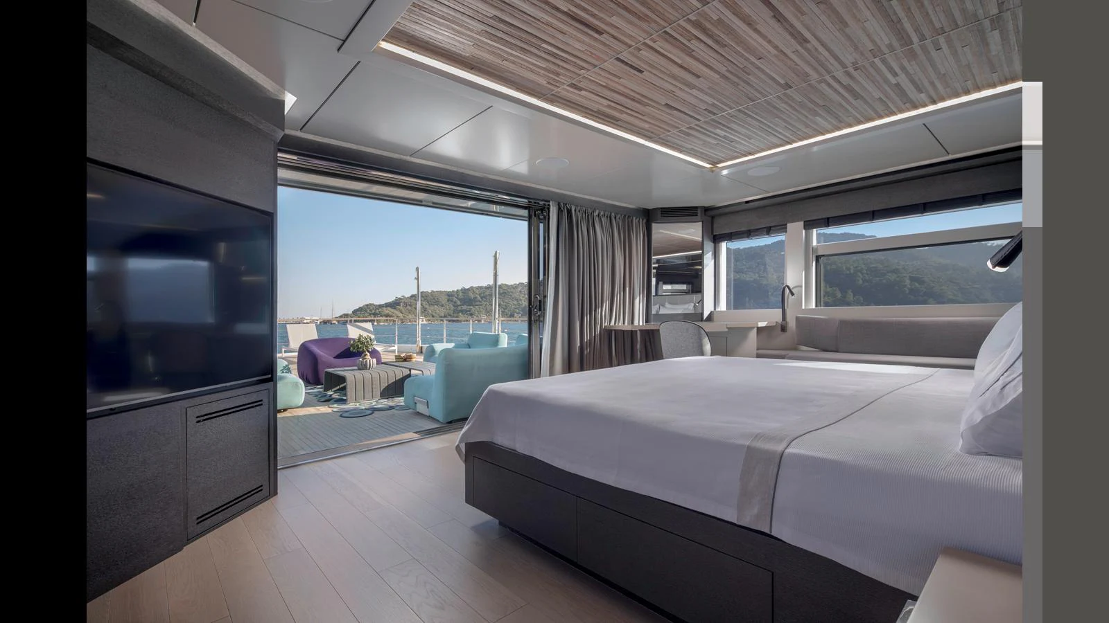 The master stateroom offers a luxurious retreat with a stunning view and direct access to the deck. aboard Q.M Yacht for Sale