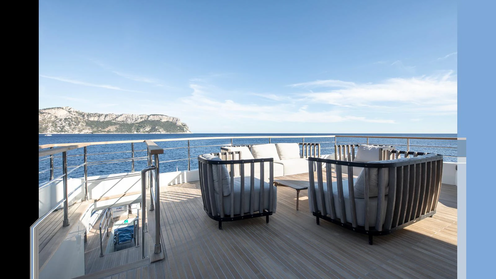 The aft deck offers a spacious and inviting area with comfortable seating and stunning ocean views. aboard Q.M Yacht for Sale