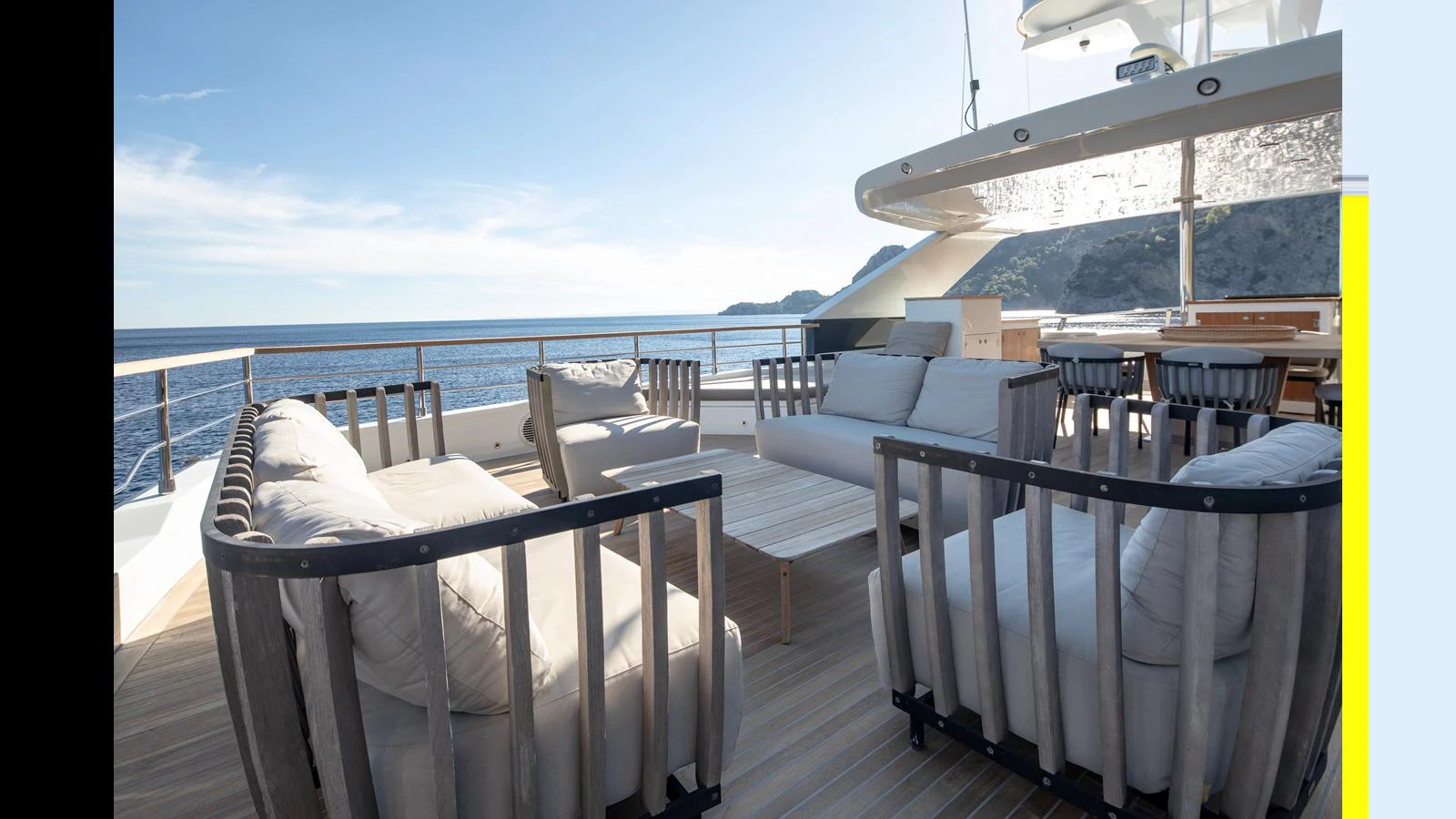 The aft deck offers a spacious and comfortable seating area with stunning ocean views. aboard Q.M Yacht for Sale