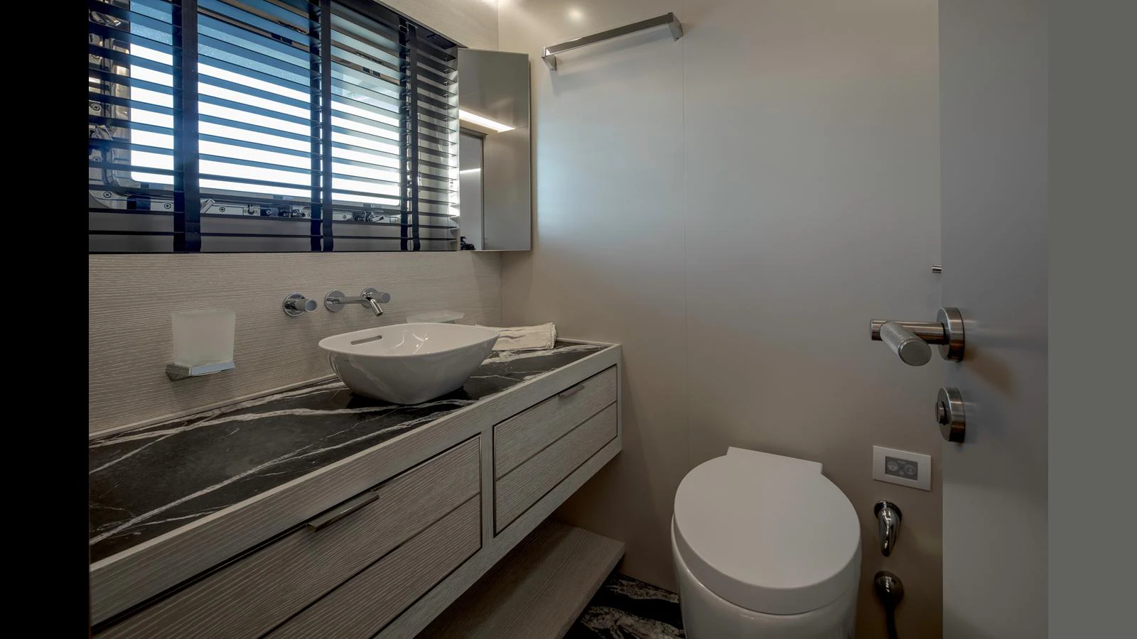 The yacht's bathroom features modern fixtures and a sleek design. aboard Q.M Yacht for Sale