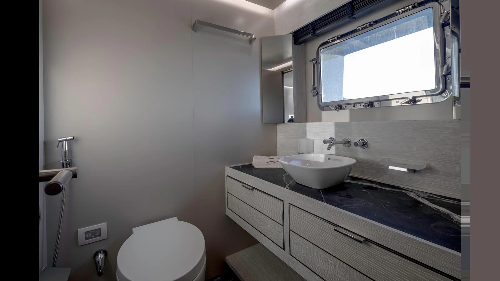 The yacht's bathroom features modern fixtures and a sleek design. aboard Q.M Yacht for Sale