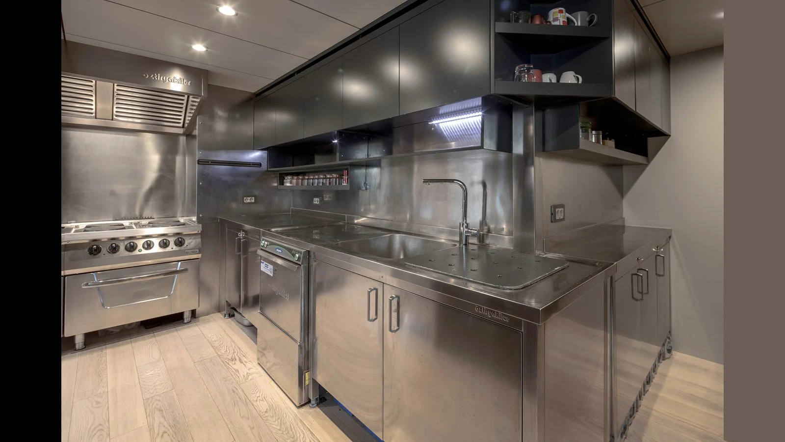 The yacht's galley features sleek stainless steel appliances and ample counter space for gourmet meal preparation. aboard Q.M Yacht for Sale