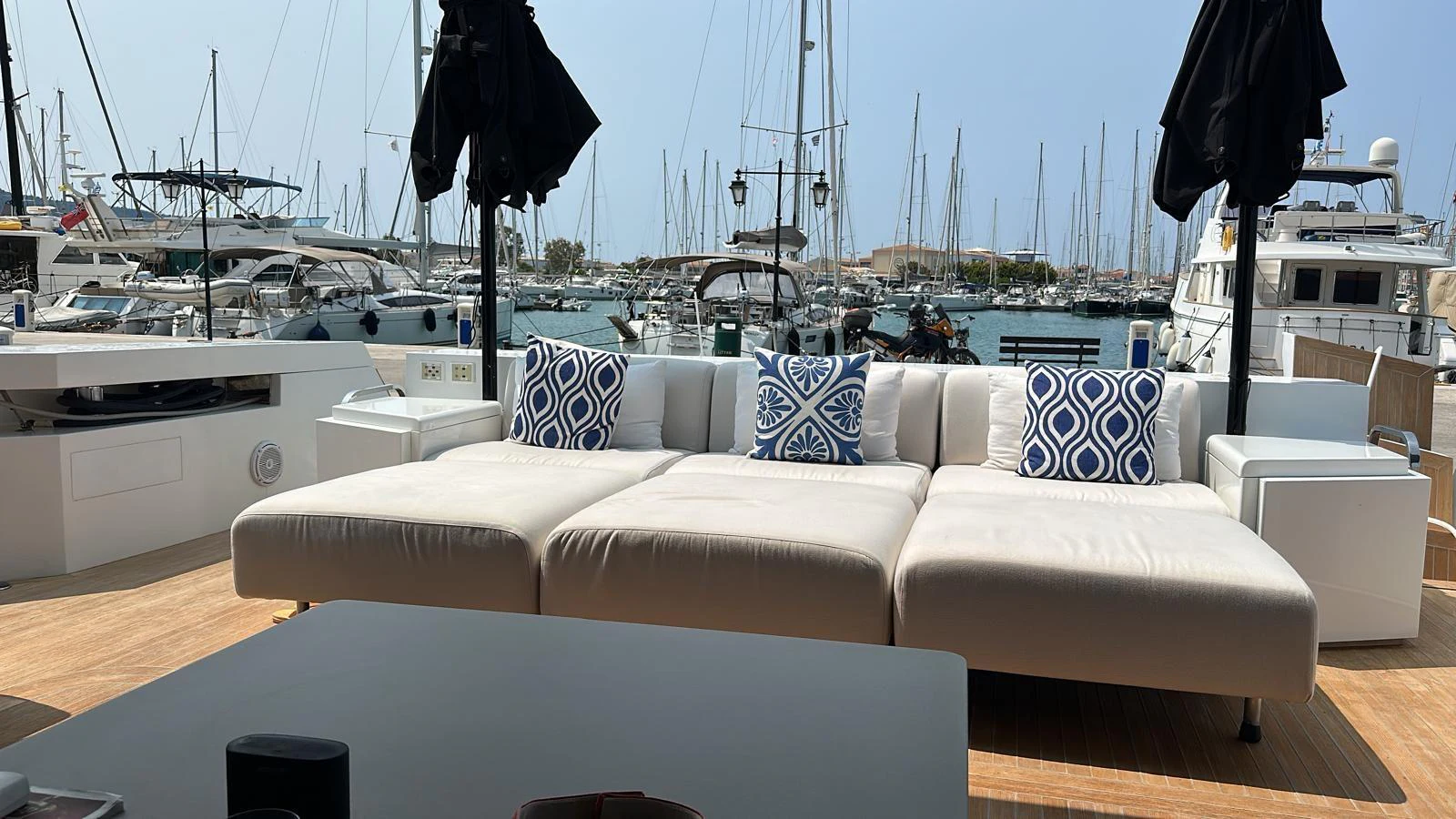The aft deck features a spacious lounging area with comfortable seating and stylish decor. aboard D&D Yacht for Sale