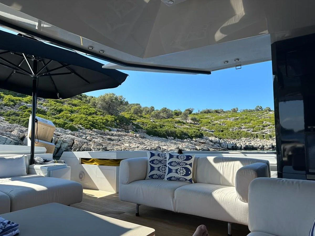 The aft deck offers a comfortable seating area with scenic views of the surrounding landscape. aboard D&D Yacht for Sale