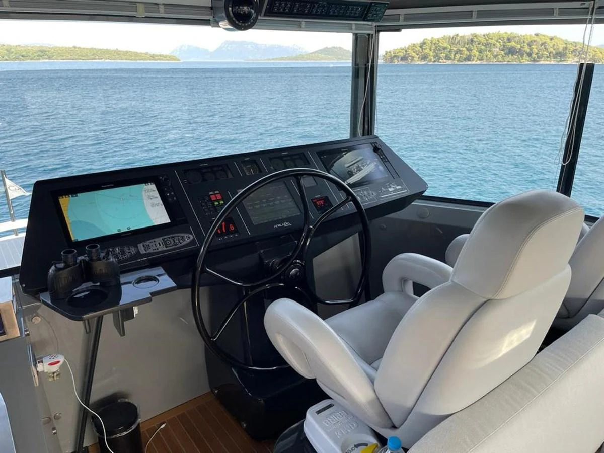 The helm station offers a commanding view of the sea with state-of-the-art navigation equipment. aboard D&D Yacht for Sale