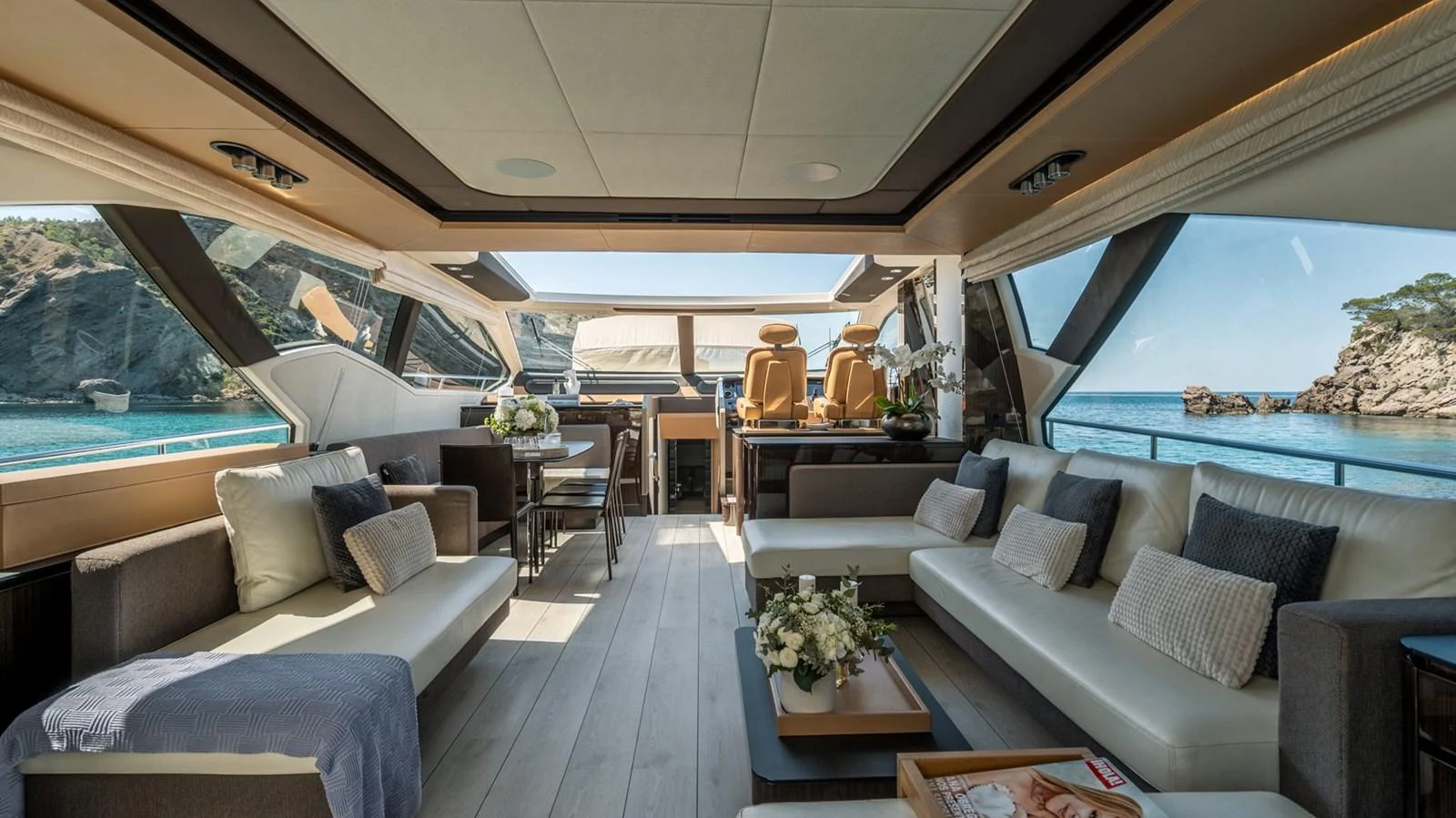 The yacht's salon offers a spacious and luxurious seating area with panoramic views of the surrounding waters. aboard GRAN ABE II Yacht for Sale