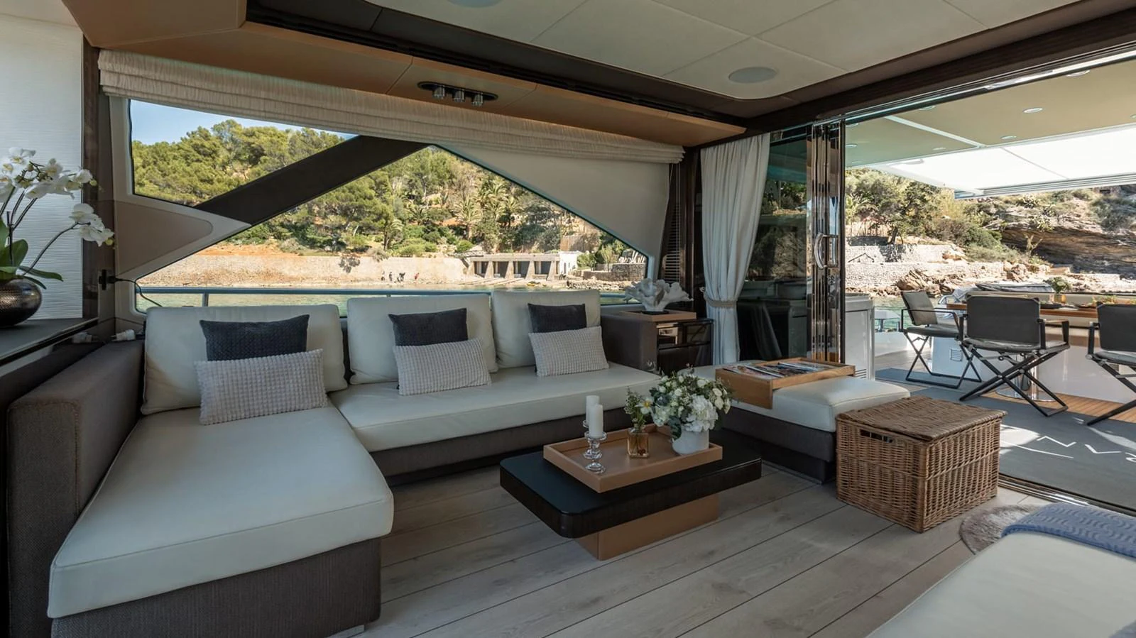 The salon offers a luxurious and comfortable seating area with a view of the surrounding waters. aboard GRAN ABE II Yacht for Sale
