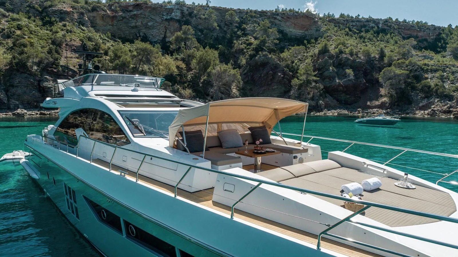 The yacht features a spacious sundeck with luxurious lounging areas, perfect for relaxation and sunbathing. aboard GRAN ABE II Yacht for Sale