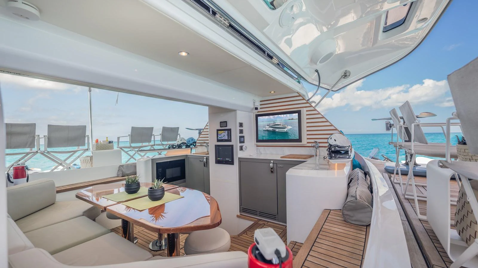 a room with a table and chairs aboard GEMINI Yacht for Sale