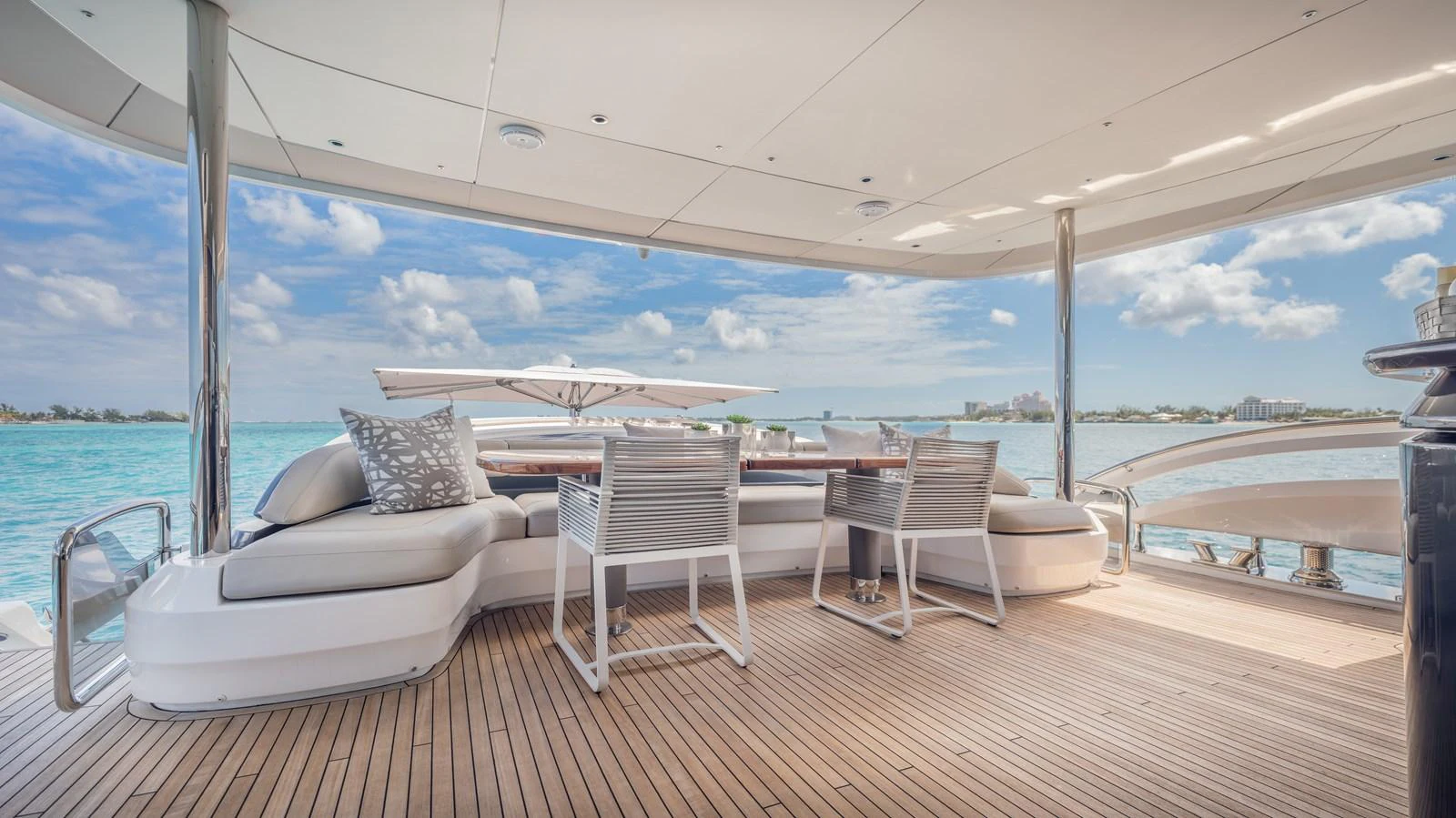 a deck with chairs and a large body of water aboard GEMINI Yacht for Sale