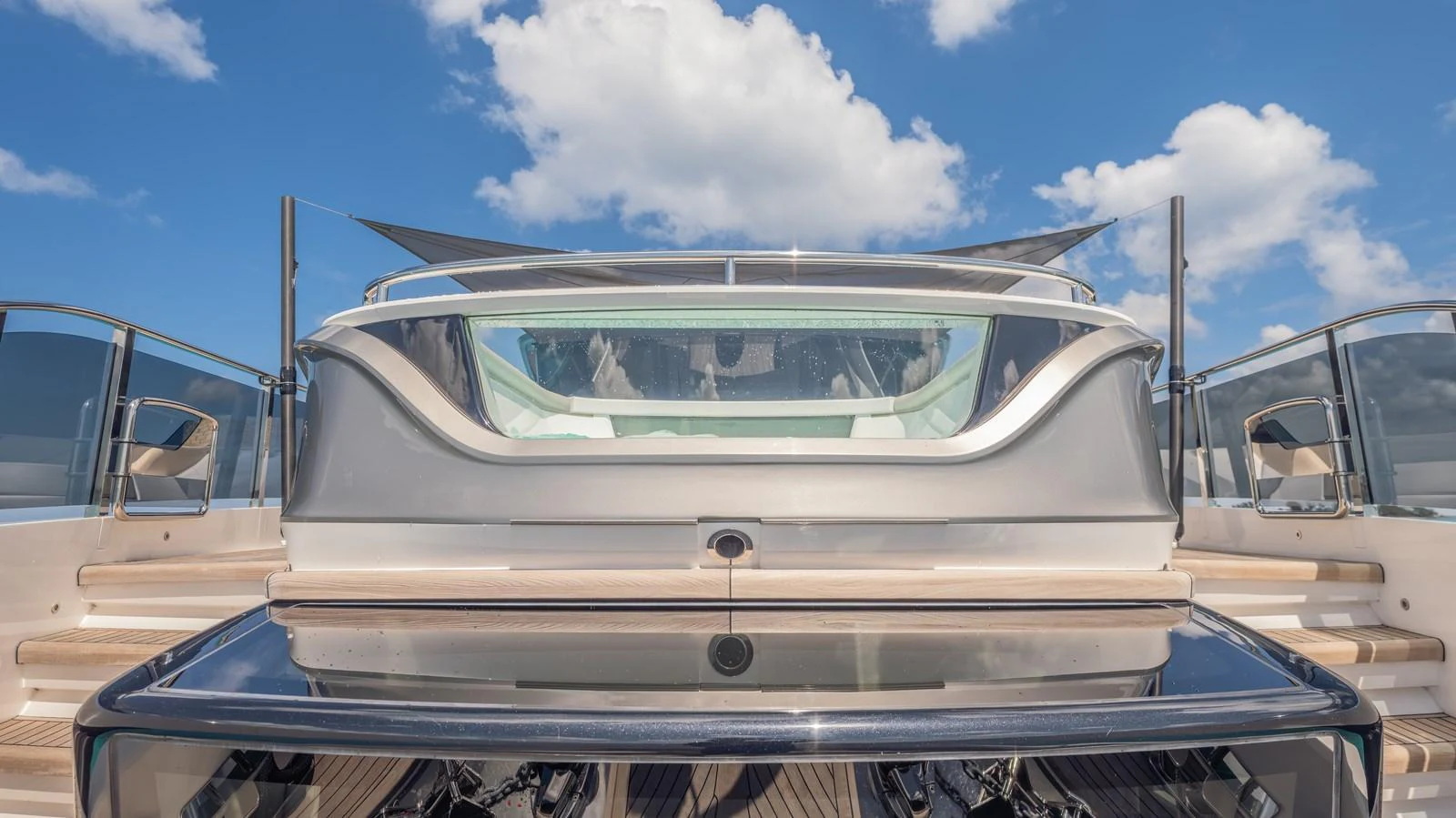 a white car on a boat aboard GEMINI Yacht for Sale