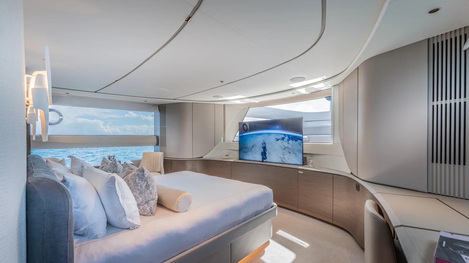 a room with a bed and a window aboard GEMINI Yacht for Sale