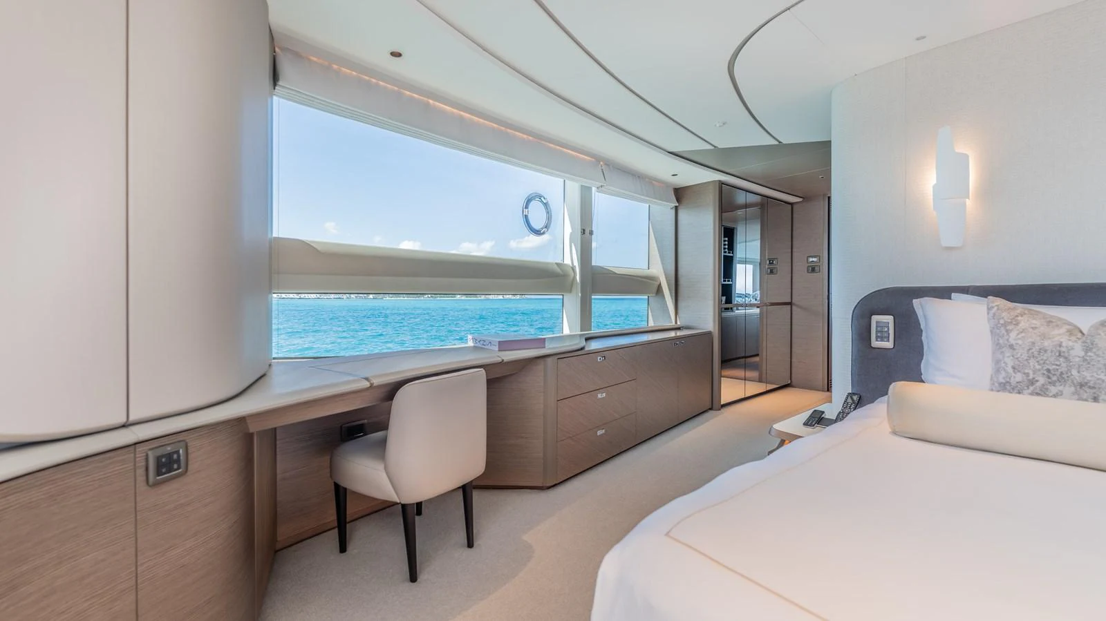 a room with a desk and a bed aboard GEMINI Yacht for Sale