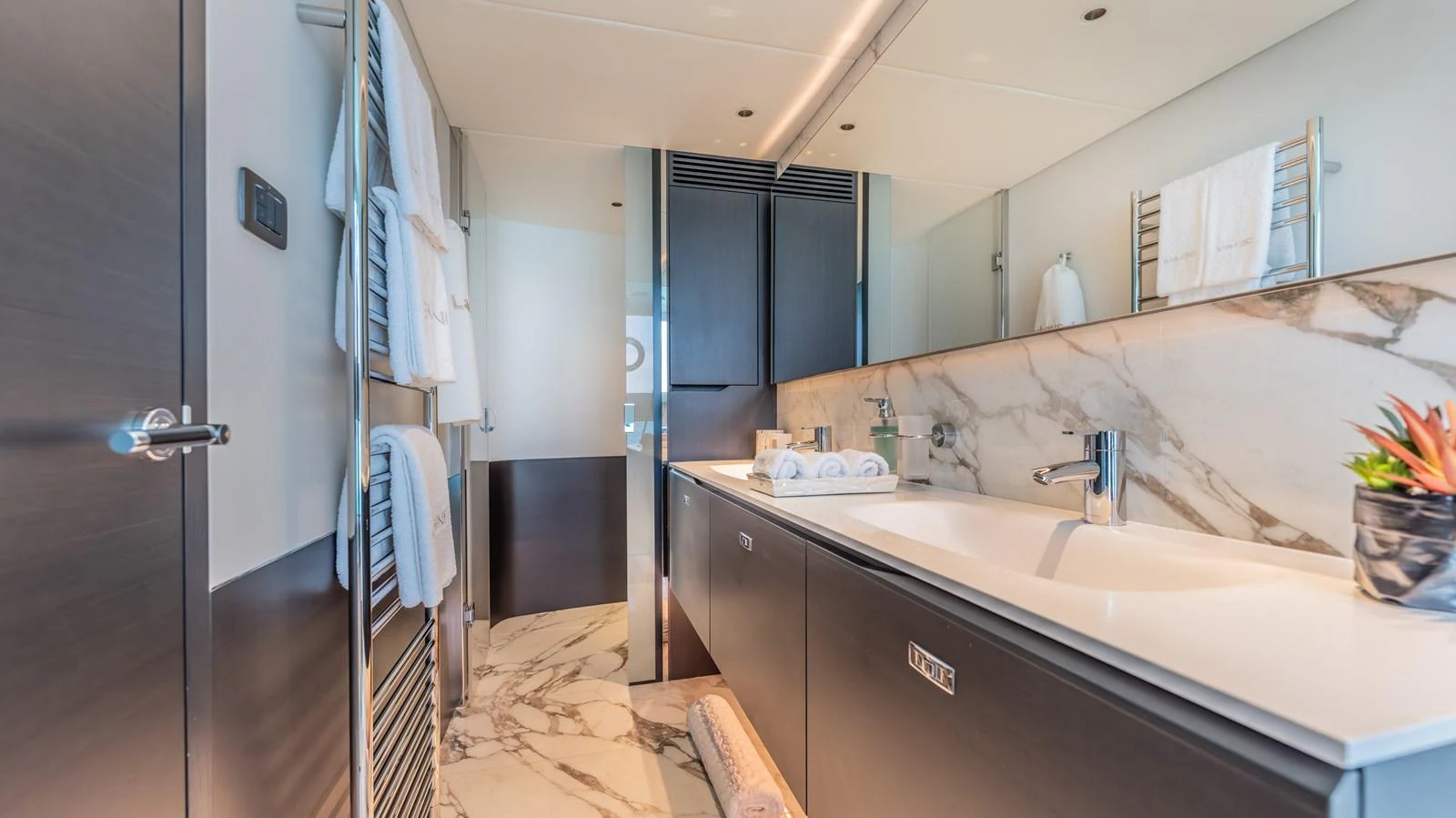 a bathroom with a sink and a mirror aboard GEMINI Yacht for Sale