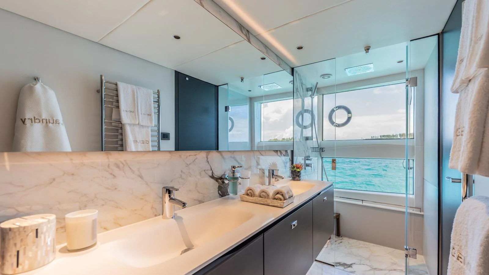 a bathroom with a large window aboard GEMINI Yacht for Sale