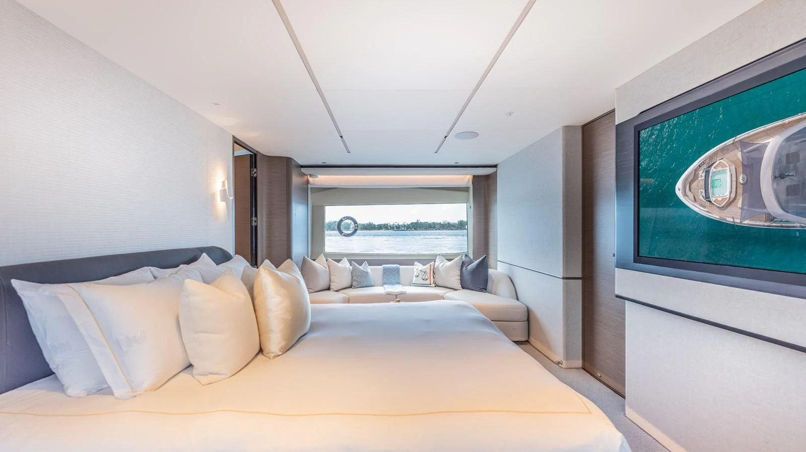 a bed with a large screen aboard GEMINI Yacht for Sale