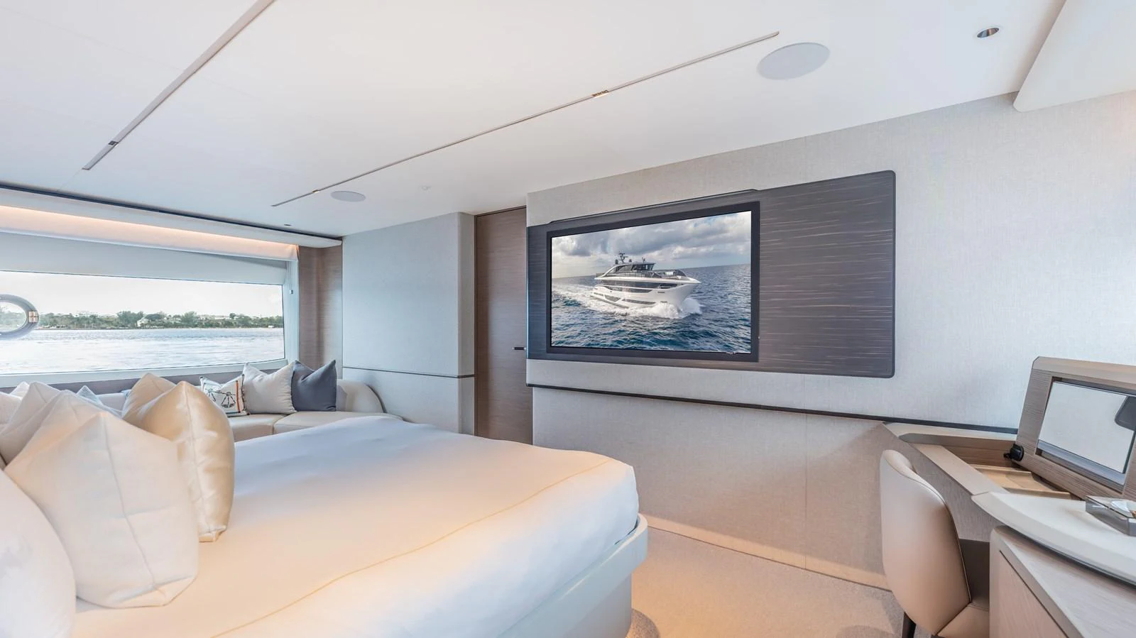 a room with a bed and a tv on the wall aboard GEMINI Yacht for Sale